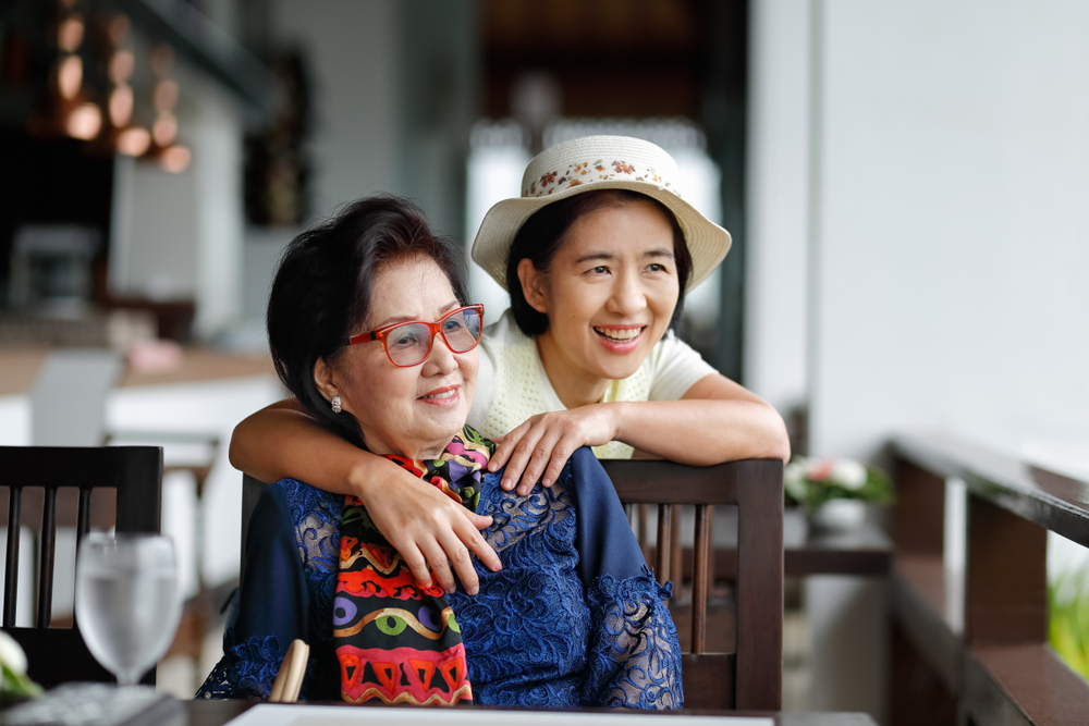 A Chinese senior and her adult daughter, related to the idea of Chinese caregiving