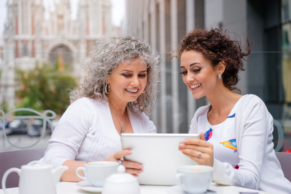 A woman going over finances with her mother