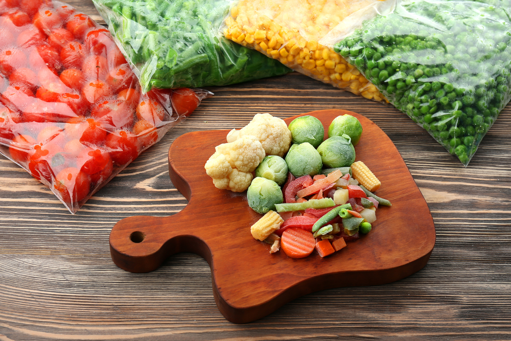 Frozen vegetables on a wooden tray