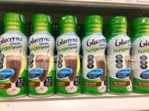 A selection of Glucerna protein shakes with green lids