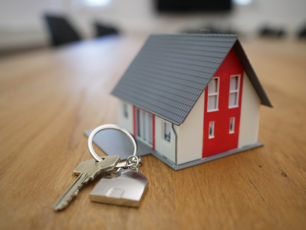 A small house and keys, illustrating a reverse mortgage