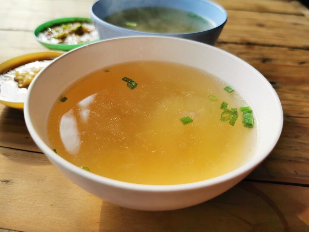 A white bowl filled with miso soup