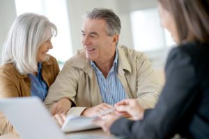 A senior couple talking to a financial advisor