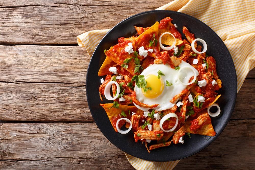 A bowl of chilaquiles with eggs