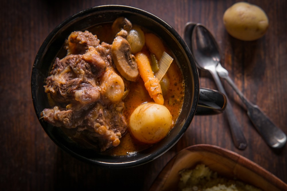 A cast iron dish with an oxtail stew