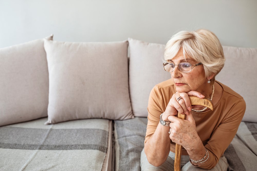 A senior woman sitting at home