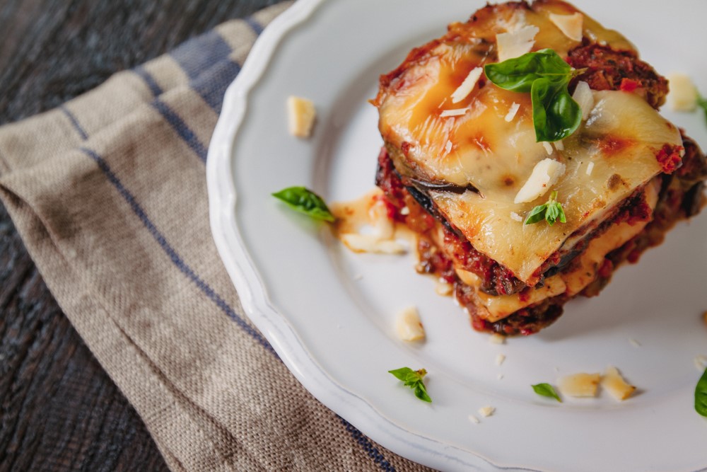 An eggplant parmesan bake on a white plate