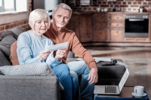 A senior couple looking at finances