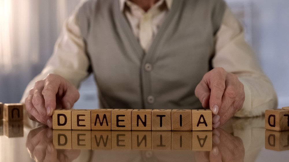 Someone with a puzzle about dementia, highlighting the importance of learning about dementia