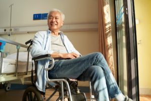 A Korean senior sitting in a wheelchair as part of Korean senior care