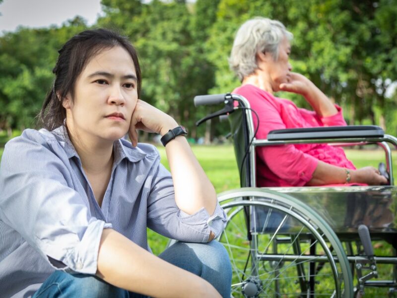 An upset daughter and her mother who is in a wheelchair, looking at whether it's possible to refuse care for elderly parents