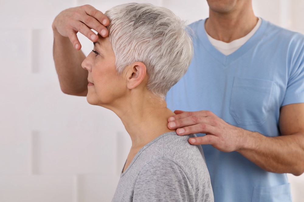 A senior experiencing some type of holistic treatment