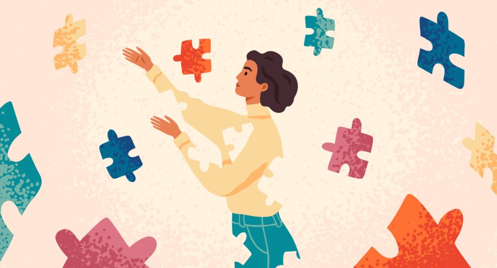 A woman putting herself back together using puzzle pieces, highlighting the idea of self-care secrets for caregivers.