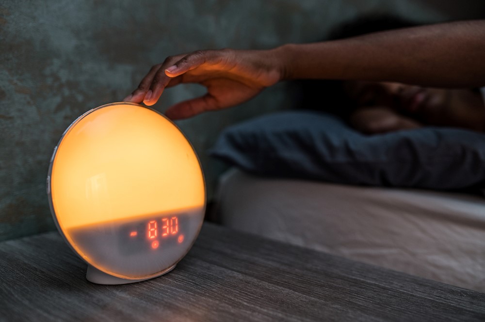 A sleep wake alarm clock that uses lights, showing how tech gifts can help seniors