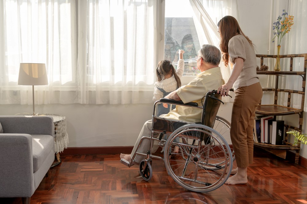 Helping a senior in a wheelchair