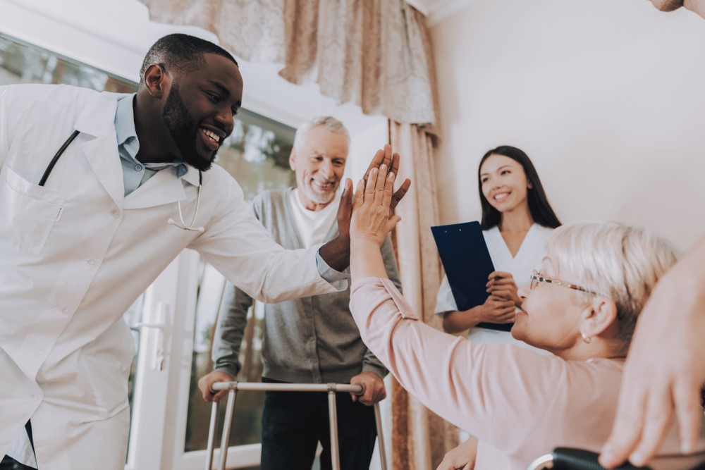 Two caregivers and two seniors