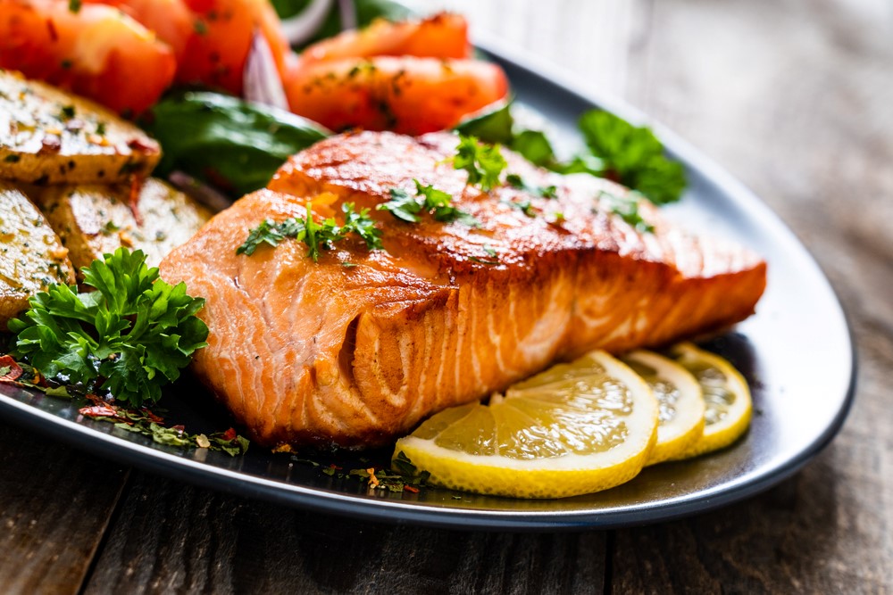 Cooked salmon on a plate, which is a type of brain food for seniors