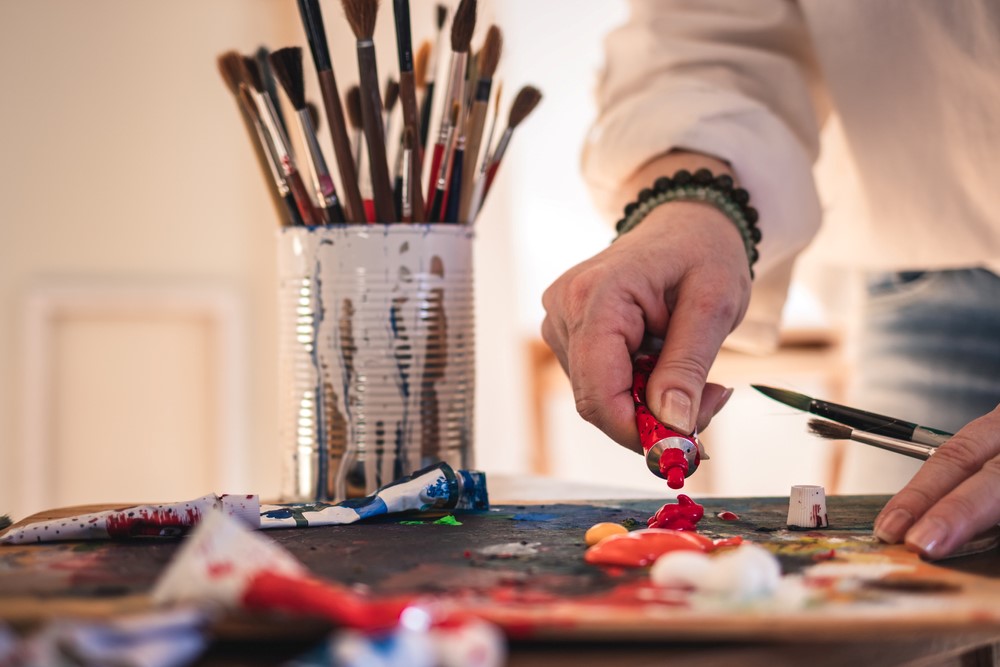 Someone painting as a type of hobby for caregivers