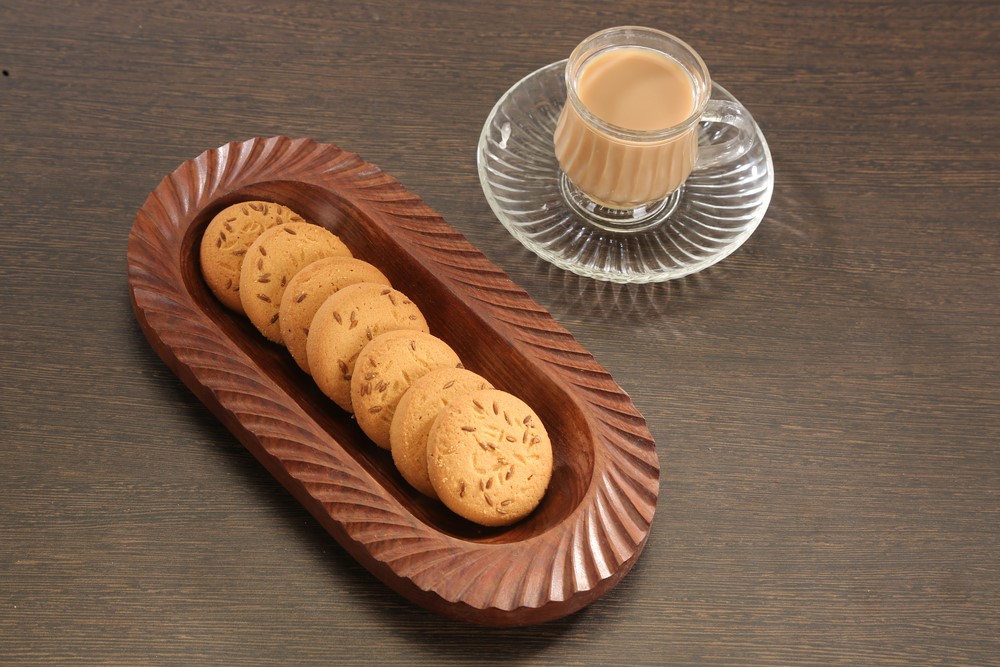 Cumin biscuits next to a milky drink