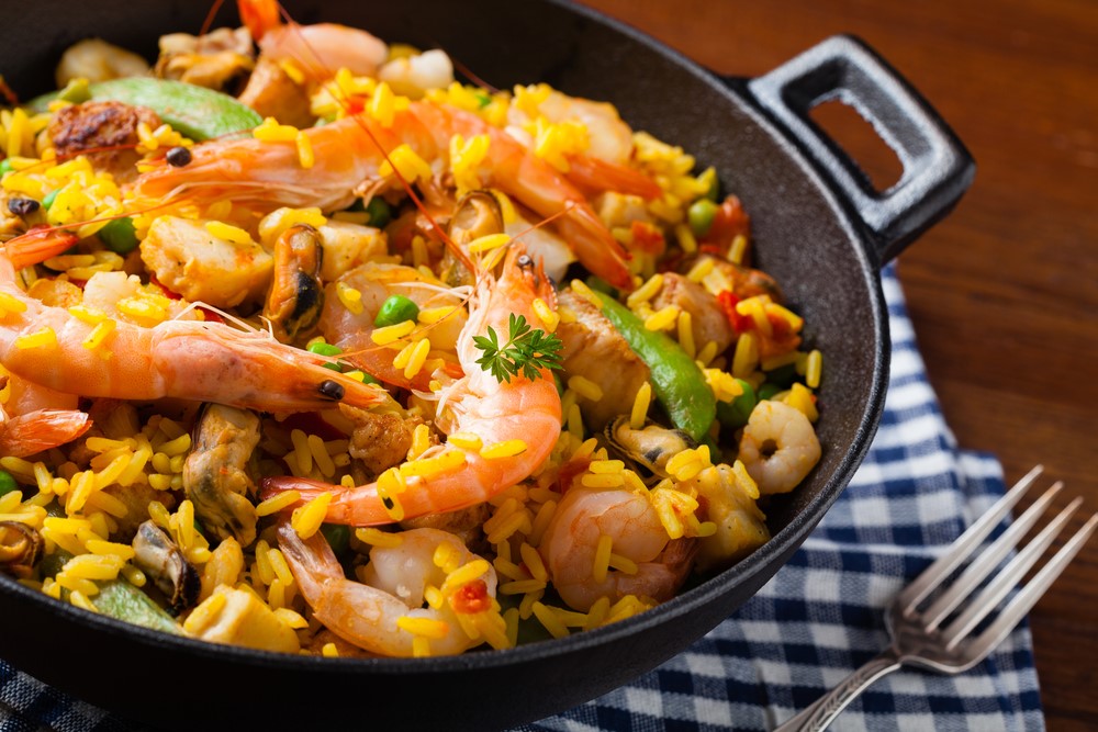 Paella with shrimp, highlighting rice cooker meals for seniors