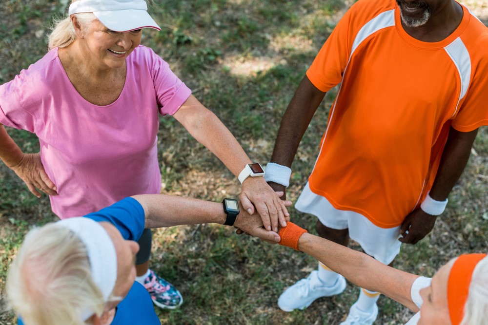 A group of seniors with wearable devices for exercise