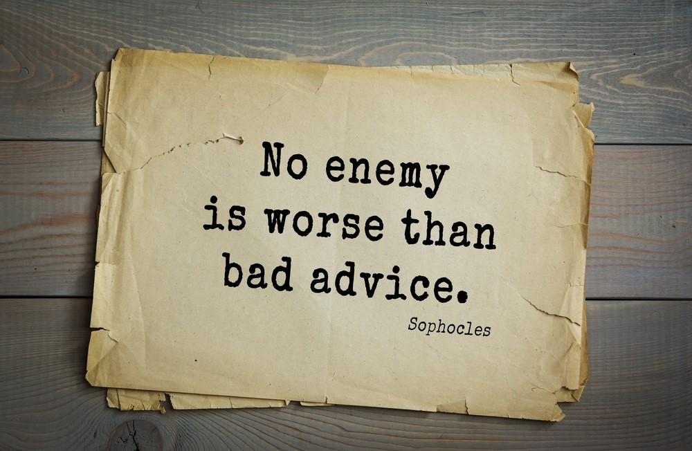 A piece of paper on wooden planks, looking at the idea that no enemy is worse than bad advice