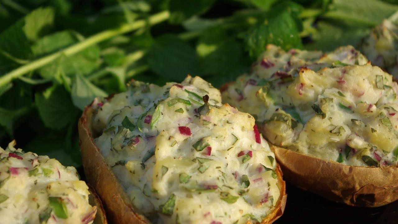 Three stuffed potatoes on a table