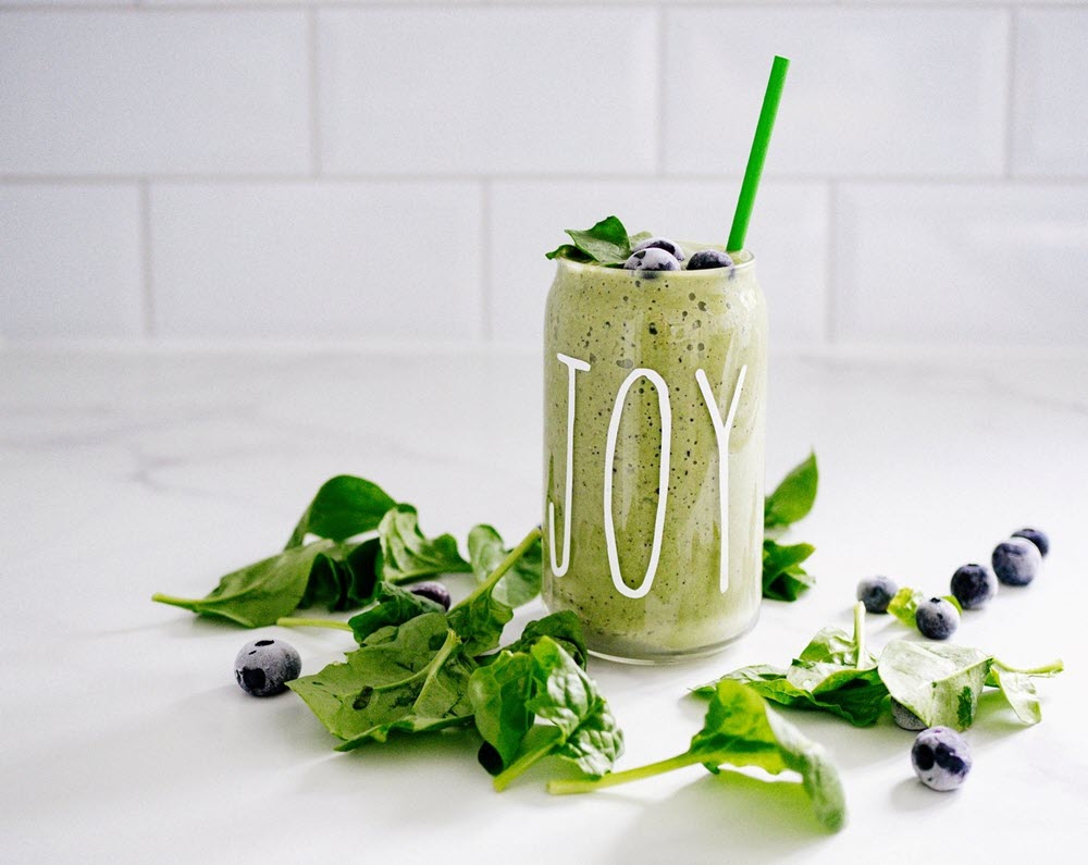 A green smoothie on a table