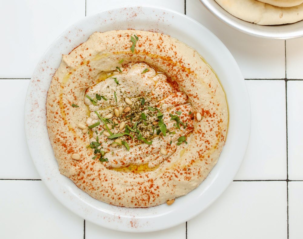 A large plate of hummus