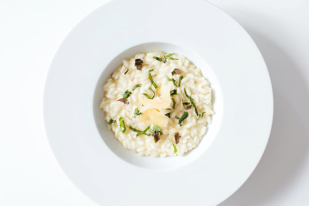 A white bowl of risotto