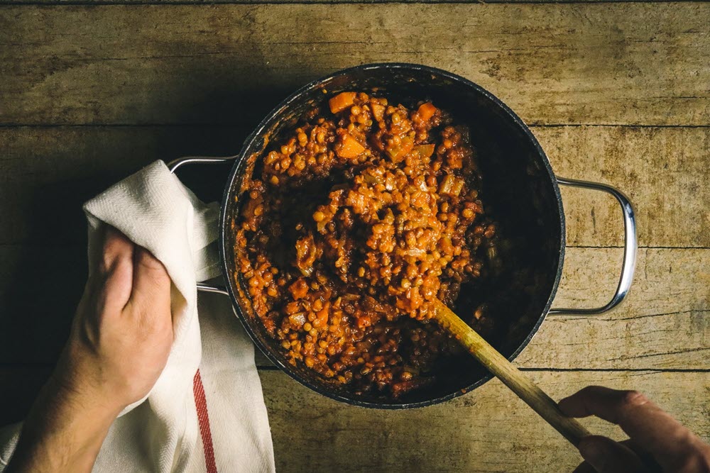 Cooked lentils in a frypan