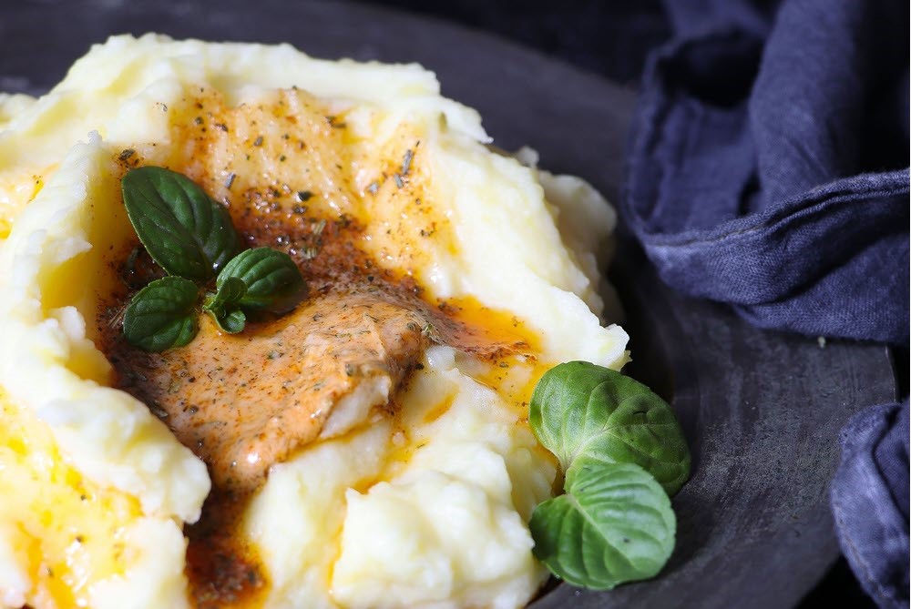 Mashed potatoes and chicken on a plate