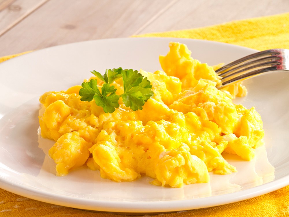 Scrambled eggs on a white plate