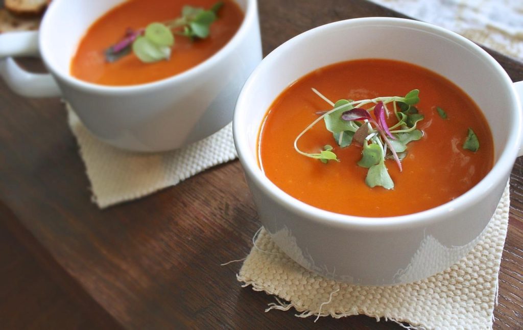 Two bowls of tomato soup