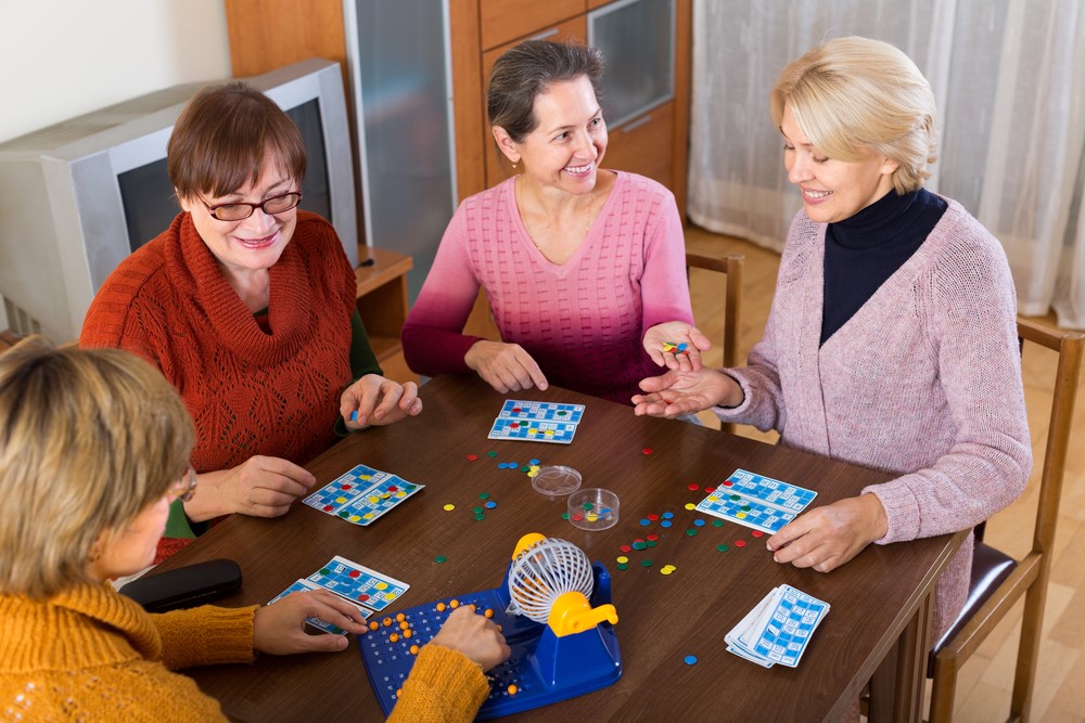 A group of female friends playing bingo at home