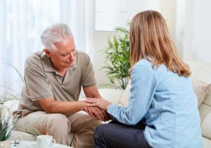 An upset senior talking to a daughter, highlighting the idea of being forced to be a caregiver