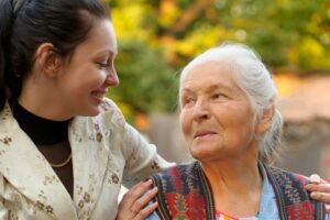 A granddaughter with her aging grandmother, highlighting the question of how to deal with a narcissistic aging parent