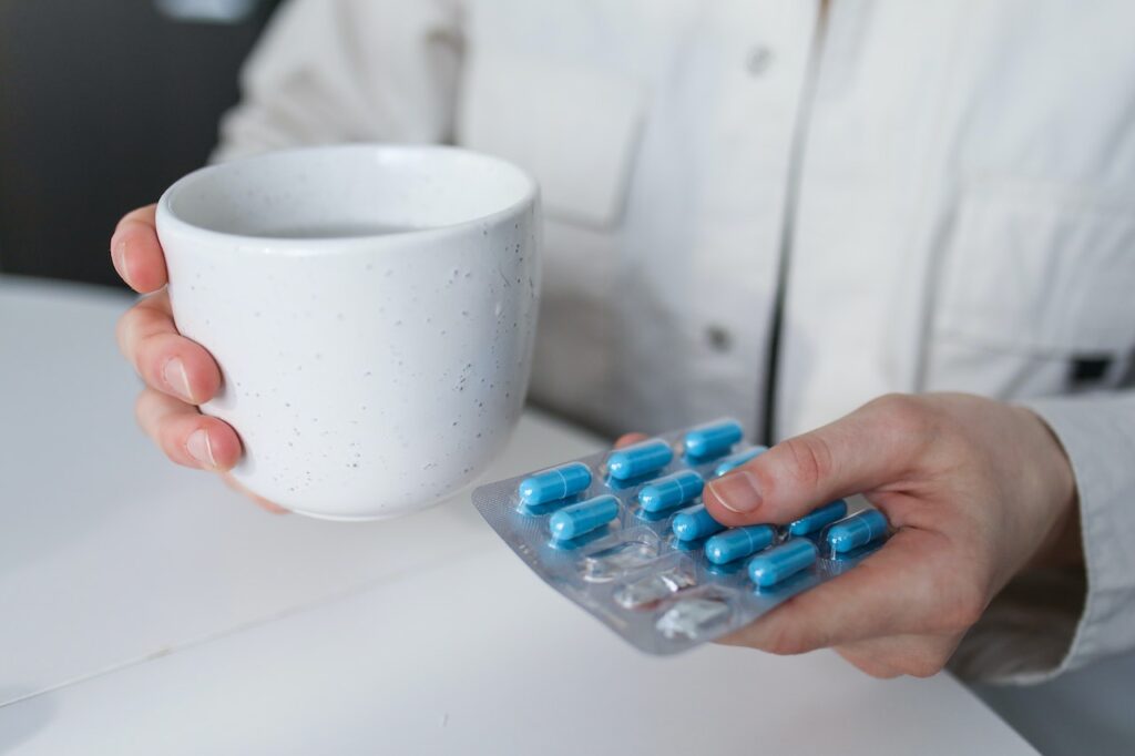 A senior holding medication that may be used to treat Alzheimer's disease