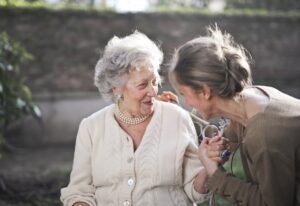 Two woman talking about retirement planning and Medicare costs