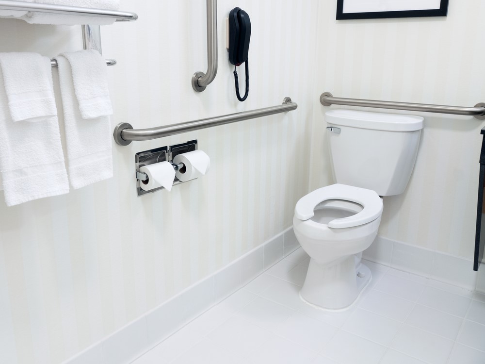 A bathroom with grab bars installed