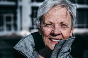 An older woman, perhaps a grandmother, highlighting the field of gerontology and promoting the health of seniors