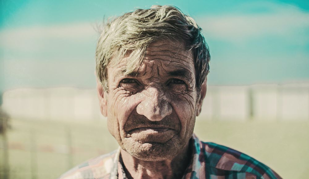 An elderly man at the beach