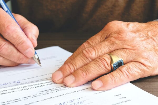 Someone signing a legal document