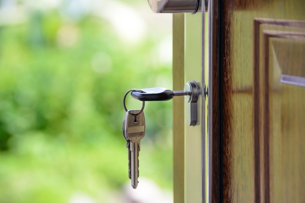 A set of keys in a lock, highlighting the question - is it illegal to lock a person with dementia in the house?