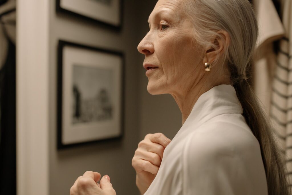 A woman in a white robe, highlighting the idea of age-related macular degeneration in seniors