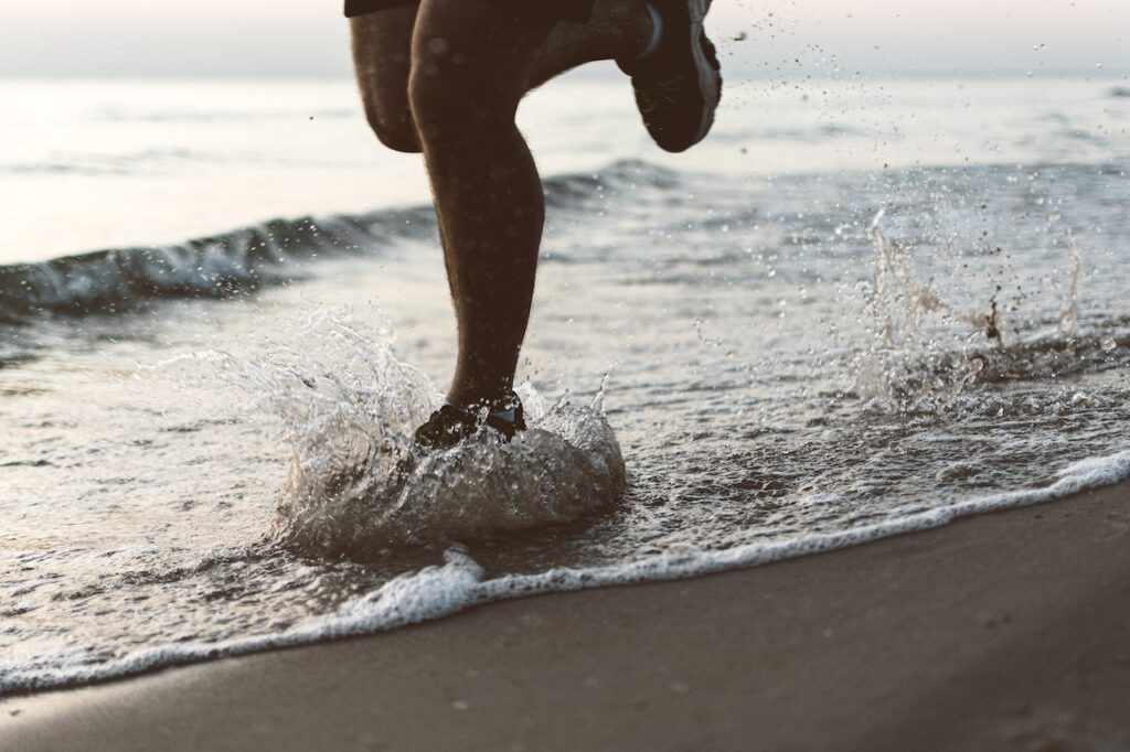 A man running in the ocean