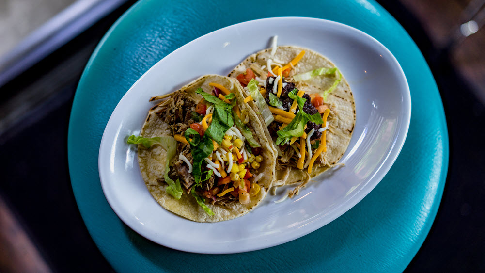 Delicious homemade tacos on a white plate