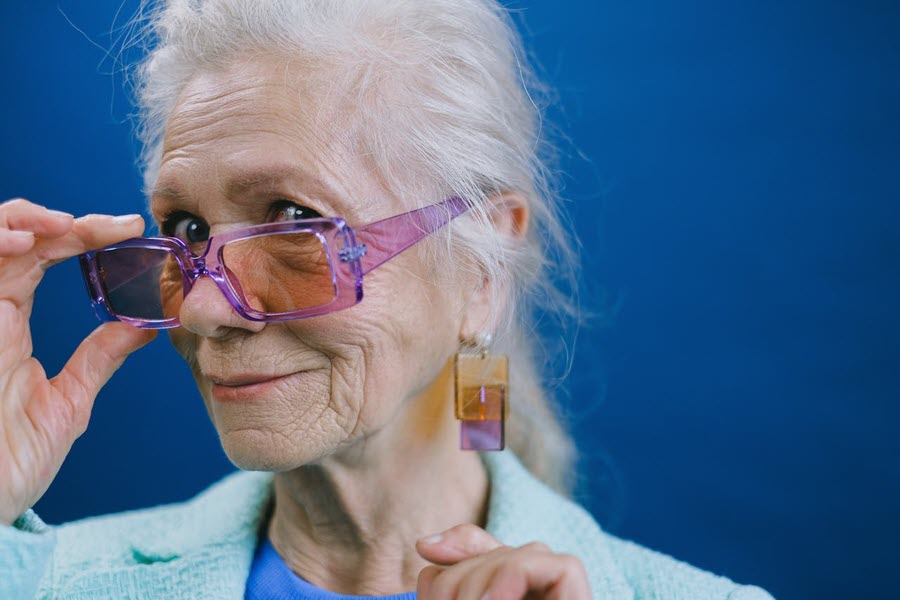 A quirky woman against a blue background