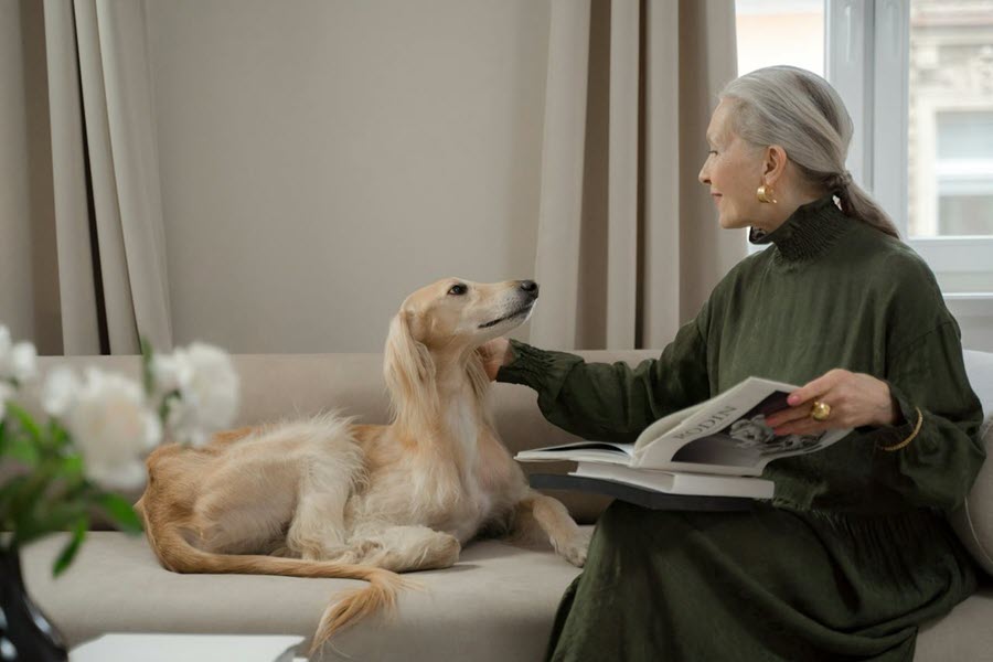 An older woman with her dog