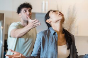 Two adult siblings fighting, where one is yelling at the other